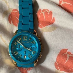 Bright blue Michael Kors large watch.